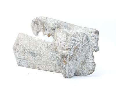 a stone object that looks like an elephant ' s head