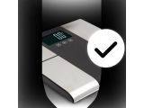 a close up of a digital scale with a check mark on it