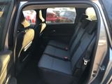 the back seats of a car are empty in the parking lot