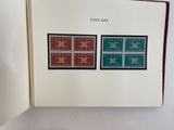 a book with stamps on the pages and a stamp on the cover