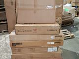 several boxes are stacked on pallets in a warehouse area