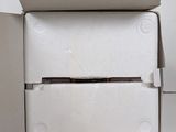 a white box that has a piece of paper in it