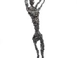 statue of a man holding a chain with his arms in the air