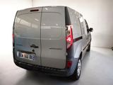 a silver van that is parked in a garage