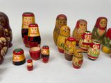 a lot of russian nesting dolls on a white surface