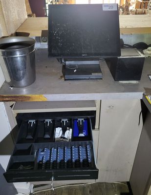 an image of a computer desk with a drawer full of items