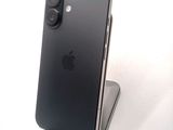 an iphone is sitting on top of a stand on a white surface