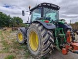 a tractor that is parked in a field