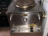 an image of a kitchen with a stove and a sink