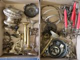 a box full of silver and red candles and other items