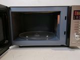a microwave that is sitting on a counter with a bowl inside of it