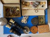 a blue table with a lot of jewelry and a pair of shoes