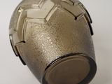 an image of a metal object on a white surface