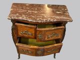a marble top desk with three drawers and a marble top top
