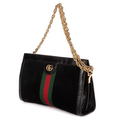 un sac à main noir avec une chaîne dorée et une rayure verte et rouge