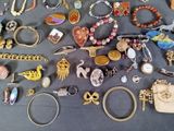 many different types of jewelry on the table