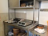 a kitchen with a lot of plates and pans on the counter