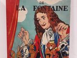 la couverture du livre « Les Fables de La Fontaine », sur laquelle figure une femme entourée de chats