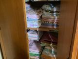 a closet filled with lots of folded towels and blankets