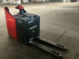 a picture of a forklift sitting in a warehouse
