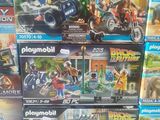 a lot of playmobil action toys on the table