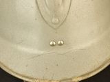 a close up of a helmet on a table