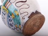 a close up of a vase with a picture on it