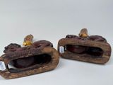 two figurines that are sitting next to each other