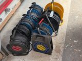 many different types of hoses sitting on the ground