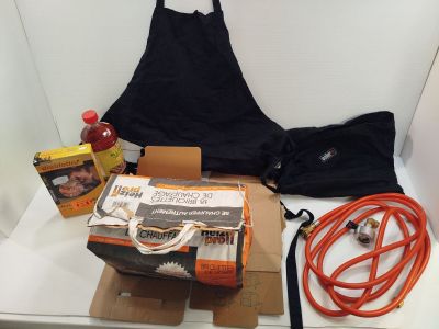 a box with a bag, hose, and other items sitting on a table