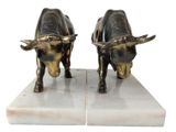 pair of brass bull bookends on marble bases