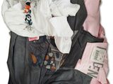 a pile of clothes that is sitting on top of each other