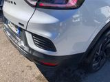a close up of the rear end of a white car