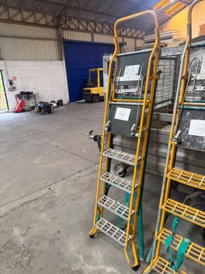 many racks with different types of equipment in a warehouse