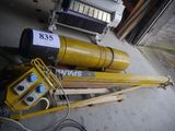 a pile of equipment that is sitting outside of a garage