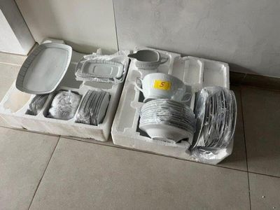 two trays that have different items in them on the floor