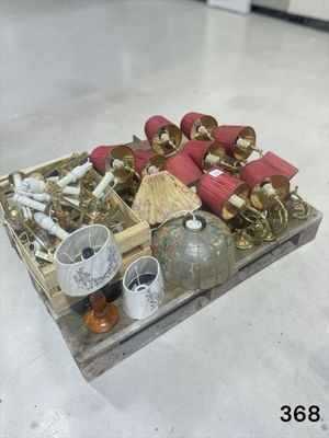 a wooden crate filled with assorted items on the floor