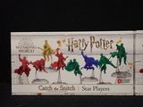 a box of harry potter action figures on a table