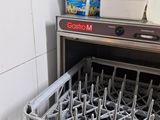 a dishwasher that is open in a kitchen