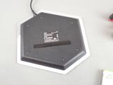 a black and white electronic device on a white table