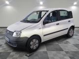 a picture of a small white van parked on a checkered floor