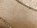 a close up of a chair with a decorative pattern on it