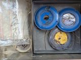 a box that has three blue plates in it