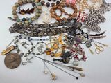 many different types of jewelry on the table