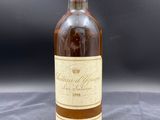 an image of a bottle of wine sitting on top of a table