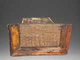a wooden box with a book on top of it