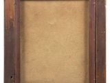 an old wooden frame with a brown linen backing