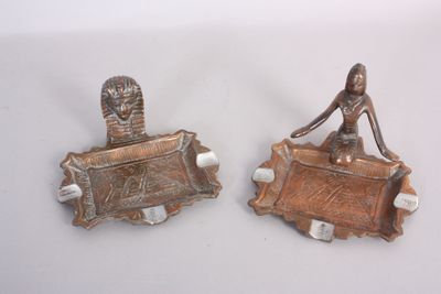 two metal objects that are sitting on a table