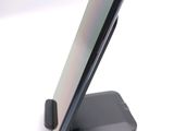 a cell phone that is sitting on top of a stand