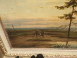 une image d'un tableau sur le mur d'une pièce